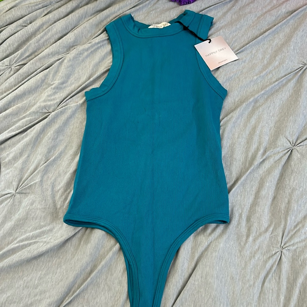 Turquoise blue body suit. Size small. Never been worn.